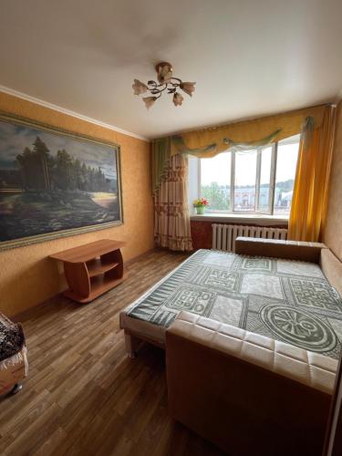 Llit o llits en una habitació de Квартира Комфорт