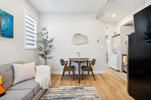 a living room with a couch and a table at The Garden Suite in London, On 1BR, 1B with free washer and dryer in London