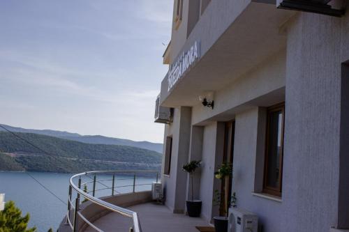 a balcony of a building with a view of the water at Zvijezda Mora in Neum