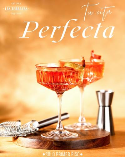 a magazine cover with two martini glasses on a table at Hotel de Turistas Iquitos in Iquitos