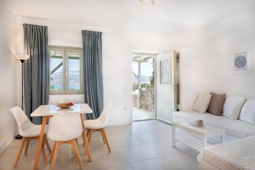a living room with a couch and a table at Lagadia Village in Andiparos