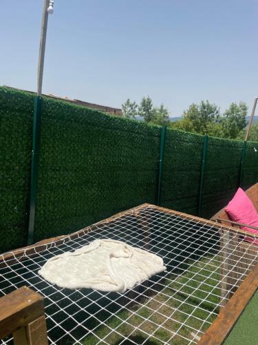 a bird cage with a white shirt on top of it at Bellatrix dome in Sapanca
