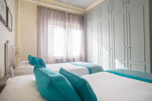 Posteľ alebo postele v izbe v ubytovaní La Plage Zurriola - IB. Apartments