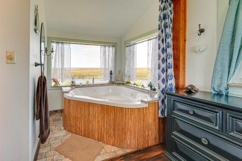 a bath tub in a bathroom with a window at Waterfront Perry Home Rooftop Deck, Pets Welcome! in Perry