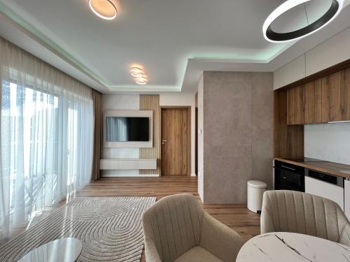 Μια τηλεόραση ή/και κέντρο ψυχαγωγίας στο Lily Lux Apartment