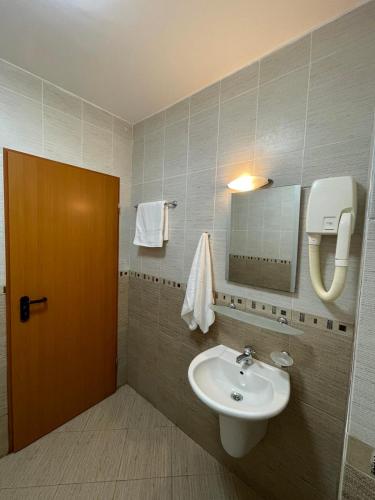 a bathroom with a sink and a mirror at Moreno in Sozopol