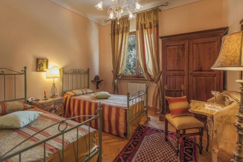 Postel nebo postele na pokoji v ubytování Villa San Biagio