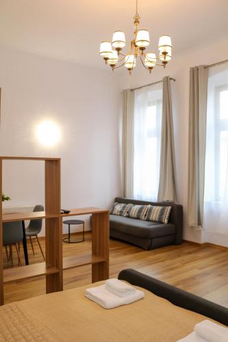 a living room with a couch and a table at Cluj Downtown Accomodation in Cluj-Napoca