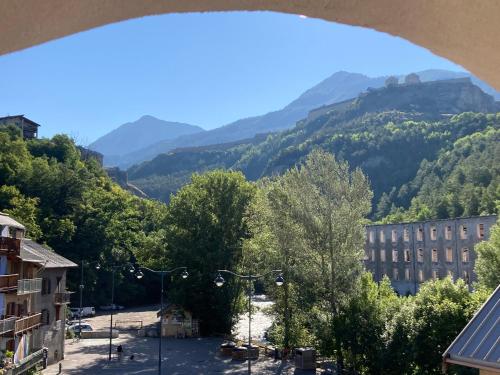 a view of a city with mountains in the background at flat-sharing Colocation in Briançon