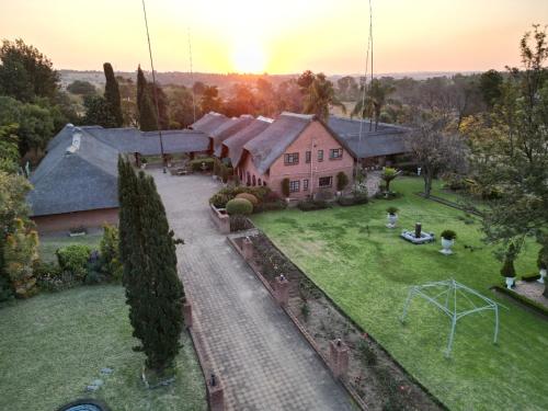 an aerial view of a house with a yard at Owls Loft Guest House in Midrand