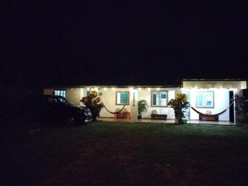 a house at night with a car parked in front of it at Casa Hostal Bouvá in El Valle