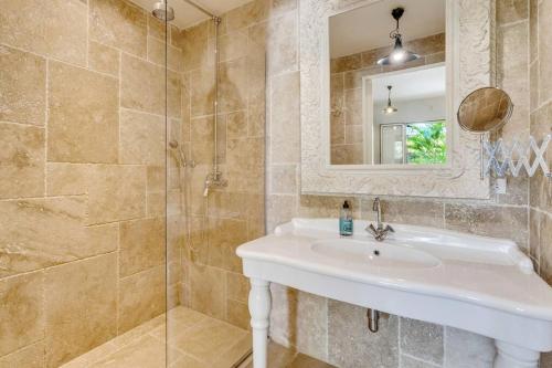 a bathroom with a sink and a shower at Ocean Breeze Apartments #33 in Kralendijk