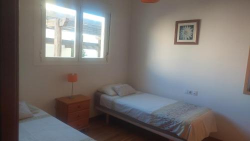 Giường trong phòng chung tại Mervilla