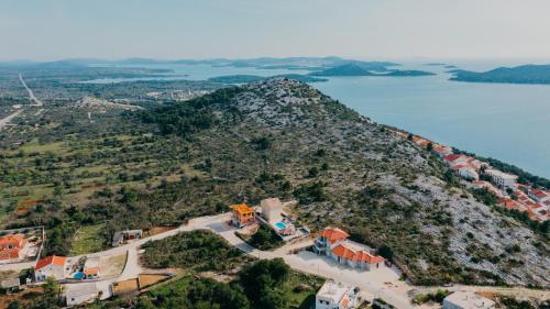 an aerial view of a small island in the water at Lavender residence Villa Drage with pool and wellness in Drage
