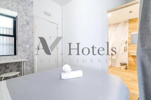 Katil atau katil-katil dalam bilik di AYZ Princesa-Auto check-in property
