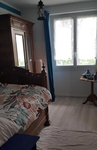 Ένα ή περισσότερα κρεβάτια σε δωμάτιο στο Chez Tchoupi