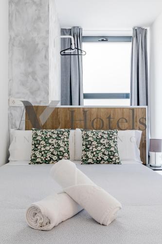 Katil atau katil-katil dalam bilik di AYZ Princesa-Auto check-in property