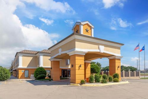 a building with a clock tower on top of it at Best Western Inn & Suites New Braunfels in New Braunfels