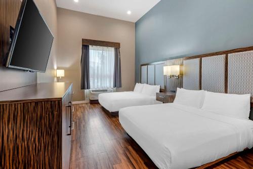 Ένα ή περισσότερα κρεβάτια σε δωμάτιο στο Best Western Plus Pflugerville Inn & Suites