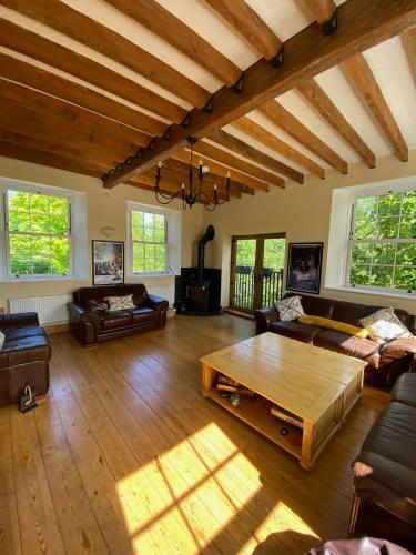 a living room with a couch and a coffee table at The Old Granary in Norwich