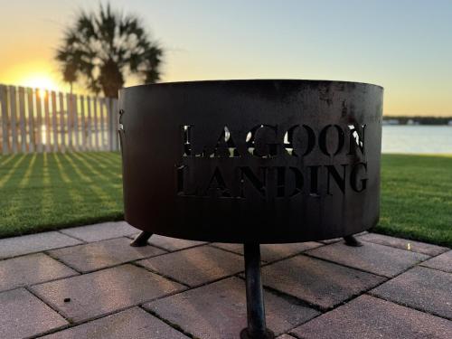 a sign that says harpoon landing sitting on a sidewalk at 3BR Condo Gulf Views with Pool, Boat Launch and Dock in Gulf Shores