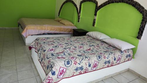 Postel nebo postele na pokoji v ubytování Villas Yoleth Hotel