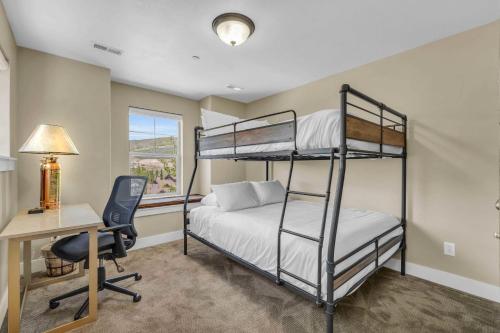 a bedroom with two bunk beds and a desk at Charming 3BR-Near Skiing & Hiking in Kamas