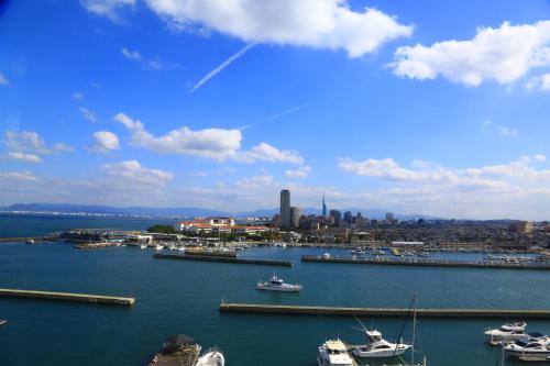 a view of a harbor with boats in the water at Hotel Marinoa Resort Fukuoka in Fukuoka