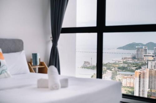 Postel nebo postele na pokoji v ubytování Seaview Infinity Pool 3BR 2Carparks 8Pax 401