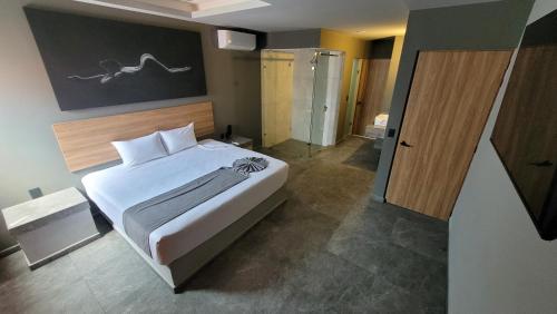 Postel nebo postele na pokoji v ubytování 4Play Motel