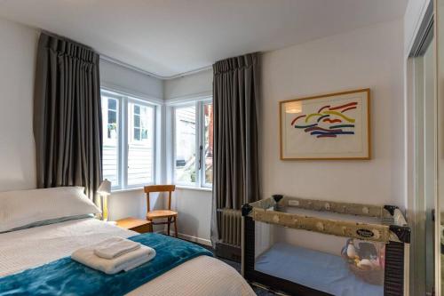 a bedroom with a bed and a window at Ideal location for groups, family, friends or work in Wellington