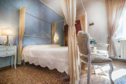 Ένα ή περισσότερα κρεβάτια σε δωμάτιο στο La Casa nel Borgo