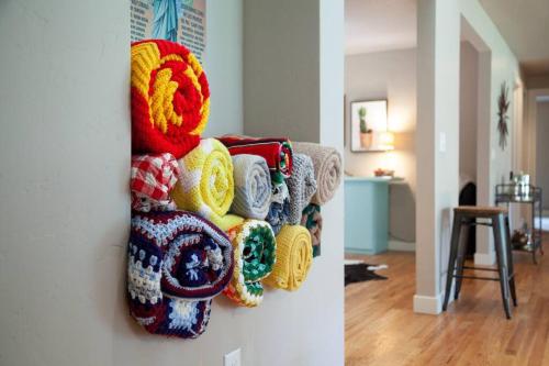 a pile of yarn hanging on a wall at Serendipitous-AC, Hot Tub, Big Fenced Yard, 2 Master Suites, in Bend