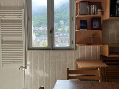 a window in a room with a table and a table sidx sidx sidx at Studio 4 pers en Centre-Ville, à 600m des Télécabines, Super Équipé avec Ascenseur - FR-1-234-319 in Cauterets