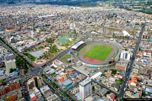 an aerial view of a city with a soccer stadium at Hotel Zeus in Riobamba