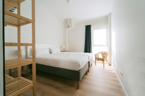 a bedroom with a bunk bed and a chair at VILLACHANCLETA in Tagle
