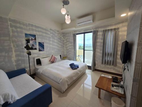 Una cama o camas en una habitación de Shui Young B&B