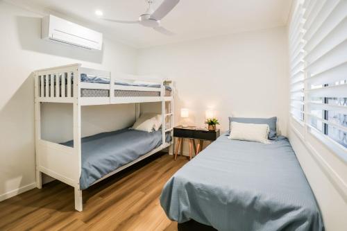 Postel nebo postele na pokoji v ubytování Aquatic Abode