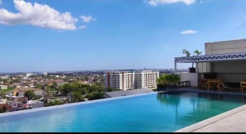 a large swimming pool on top of a building at Student Park Apartment by AS Room in Seturan