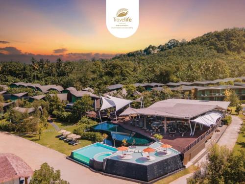 an aerial view of a resort with a swimming pool at Kalima Resort and Villas Khao Lak in Khao Lak