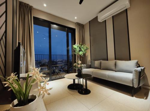 a living room with a couch and a table at Millerz Square Old Klang Road in Kuala Lumpur