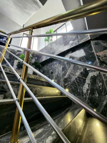an escalator in a building with a glass at Paradise Beach Resort Lagos in Lagos