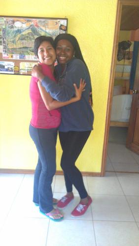 two women hugging each other in a store at La Casa del Molino Blanco B&B in Baños