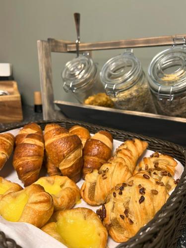 a tray of pastries and croissants on a table at Andenes Suitehotel in Andenes