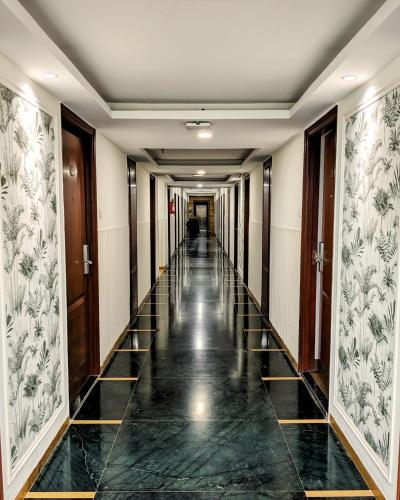 a hallway of a building with a long corridor at Comfort Inn in Lucknow