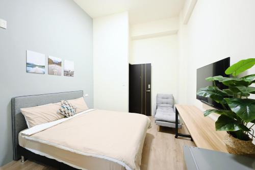 谷園酒店公寓Good Garden Apartment房間的床