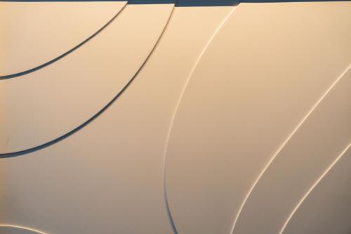a close up view of a white wall with lines at Osmann Space in La Spezia