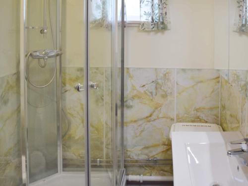 a bathroom with a shower and a toilet at 6 person holiday home in Sandhornøy in Røssnes