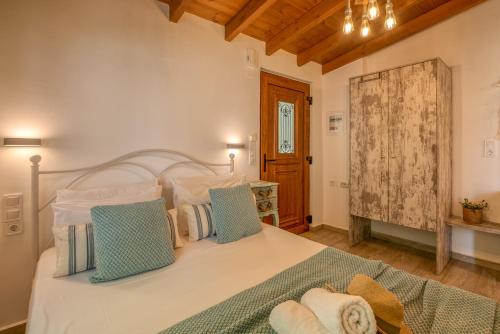 Postel nebo postele na pokoji v ubytování Vitis Vinifera Tranditional Studio Apartment