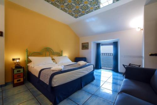 Un ou plusieurs lits dans un hébergement de l'établissement Ravello Art Hotel Marmorata